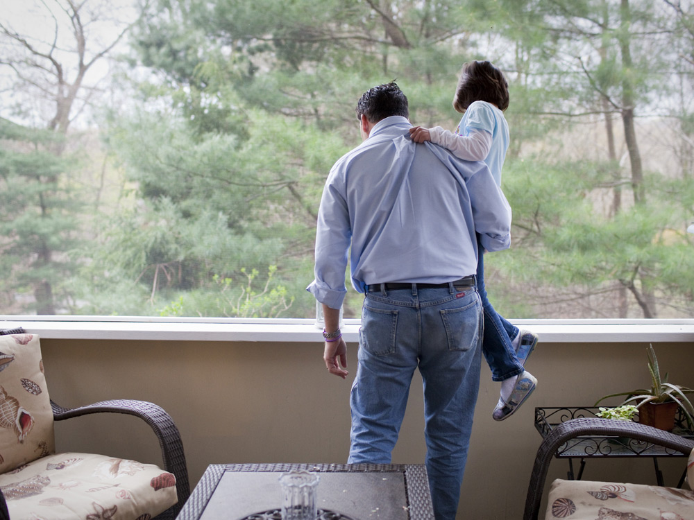 Isabelle and her father look out a window